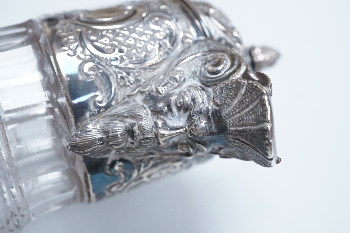 A late Victorian silver mounted cut glass claret jug, by Henry Wigfull, Sheffield, 1897, with mask spout and decorated with foliage and scrolls, height 27.5cm.